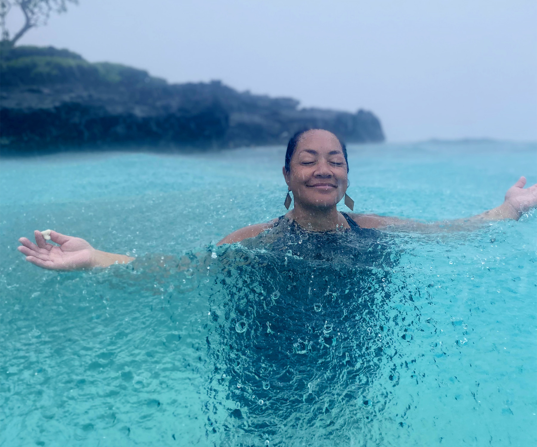 Kathy Weber-Bates swimming at the sacred island of Hatana, moments after discovering a heart-shaped coral.